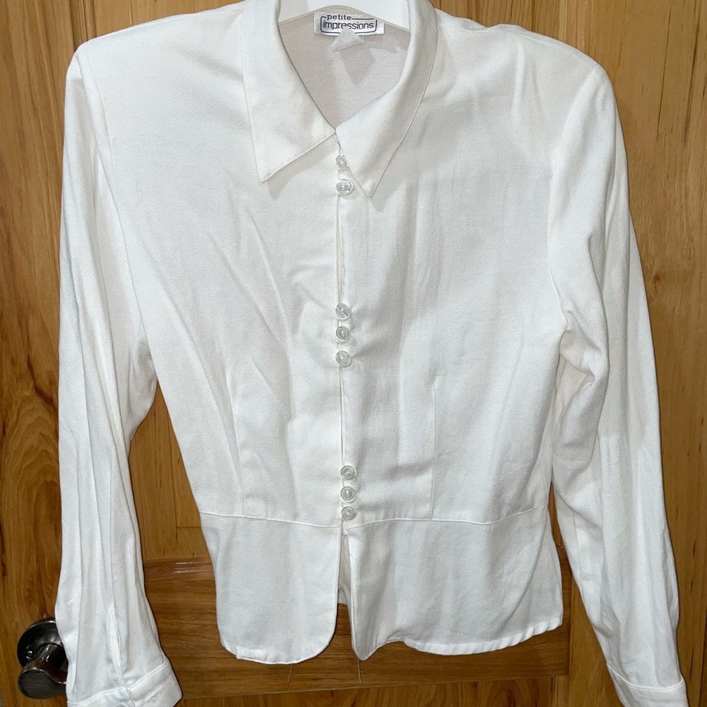 White blouse with buttons and shoulder pads